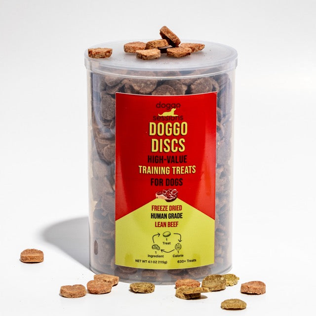 Container of DOGGO DISCS high-value training treats for dogs red and yellow keg of treats on a white background
