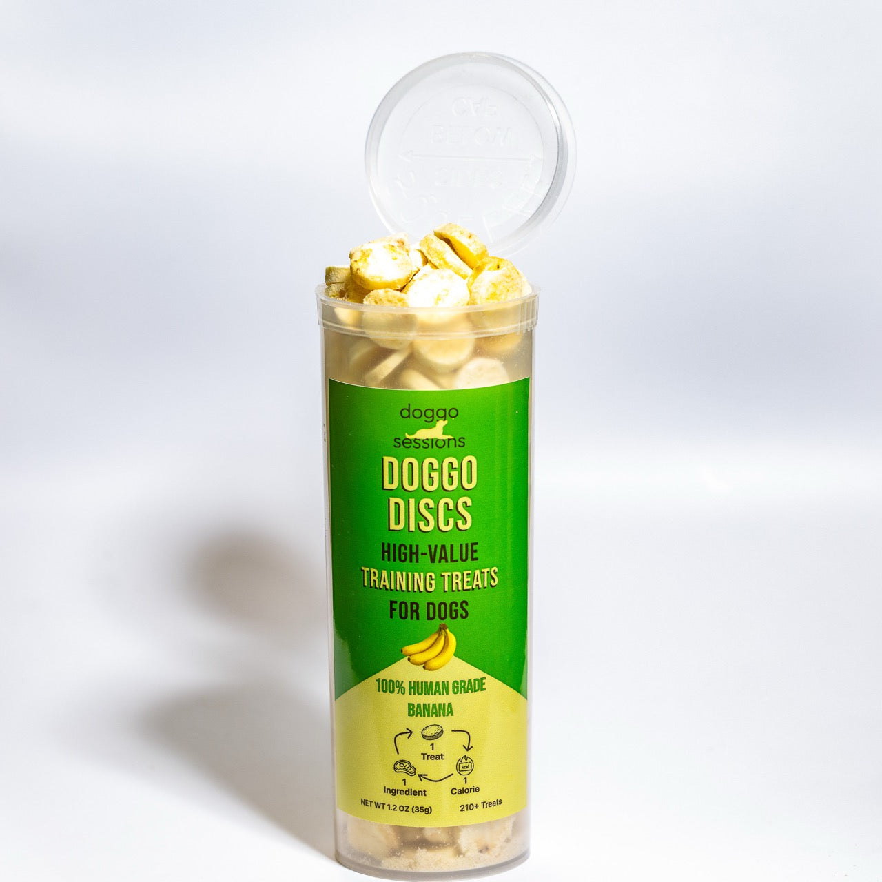 Container Doggo Discs high-value Banana training treats for dogs in a clear container with green label on a white background