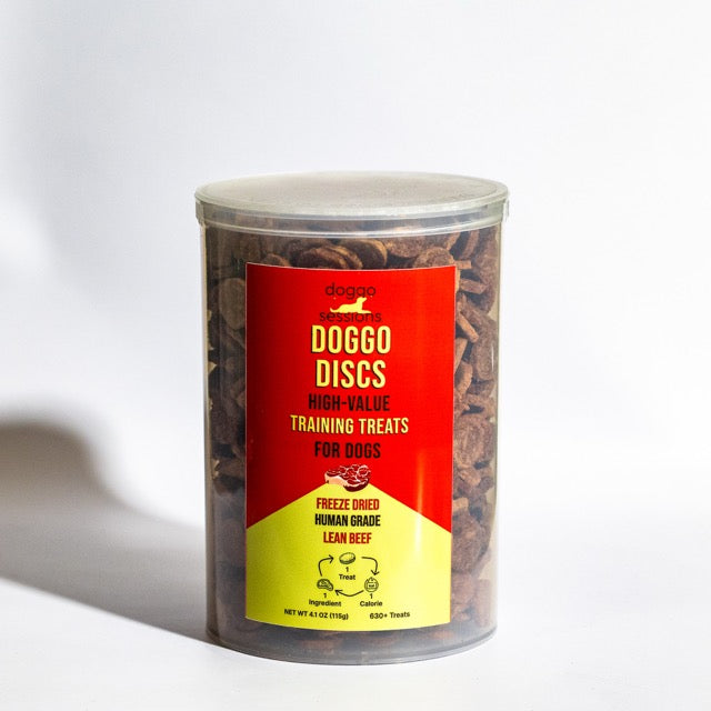 Container of DOGGO DISCS high-value training treats for dogs red and yellow keg of treats on a white background