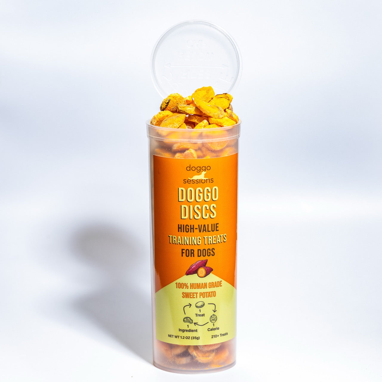 Barrel Doggo Discs high-value Sweet Potato training treats for dogs in a clear container with an orange label.