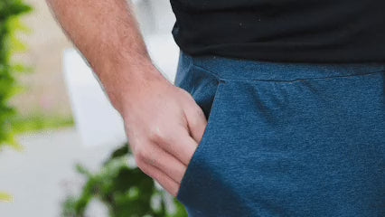 Pulling a Doggo Discs treat tube from a pocket